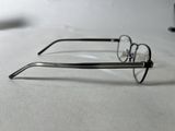 a pair of glasses sitting on a white surface