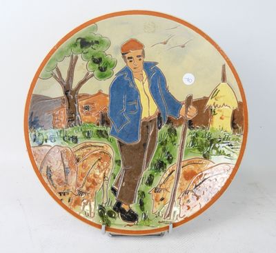 Plat circulaire en terre cuite à décor d'un berger et ses mo…