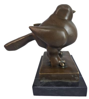 statue of a bird on a marble base on a white background