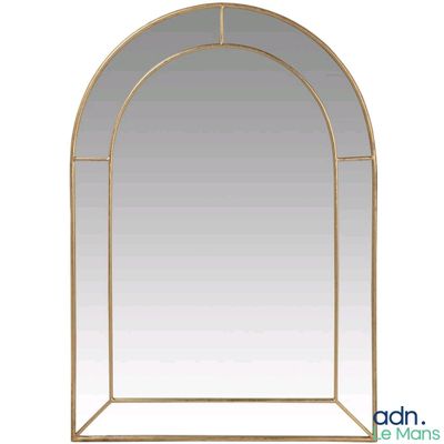 a gold arch shaped mirror with a white background