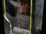 the box is open to show the inside of the alien figure