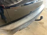 a close up of a car with a person standing next to it