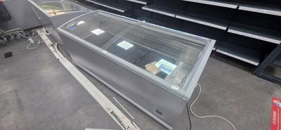 a glass display case in the middle of a store