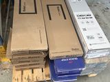 many boxes stacked on top of each other on the floor