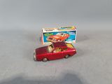 toy car with box on top of it sitting on a table