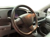 dashboard view of a car with a steering wheel and dashboard controls