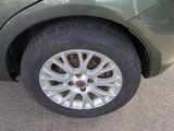 a close up of a car ' s tire on the street
