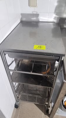 a small oven that is sitting in the corner of a kitchen