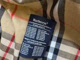 a close up of the label on a burberry checkered shirt