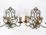pair of wrought iron wall sconces with candle holders
