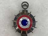 an image of a badge with a red and blue center