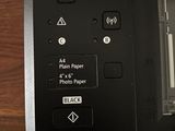 a close up view of a printer on a wooden table