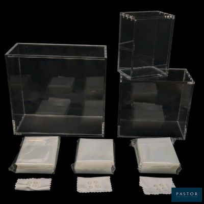 three clear plastic boxes with lids and napkins on a black background