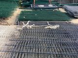 a lot of wire mesh on the ground in the yard