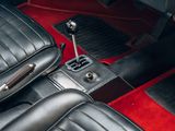 an image of a car ' s interior with red carpeting