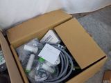 a box with a bunch of wires in it on the floor