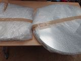 two pieces of plastic wrapped in plastic wrap on a table