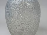 a glass vase that is sitting on a table