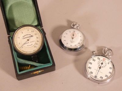 two pocket watches and a pocket watch in a box