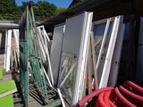 many different types of windows and doors in the yard