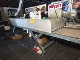 an image of a conveyor belt in a warehouse