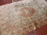 a large rug on the floor in a room