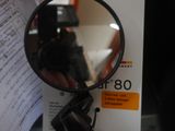 a person holding a magnifying mirror in their hand