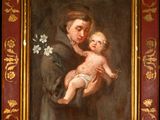 an old painting of a man holding a baby in his arms