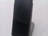 a cell phone that is sitting on top of a stand