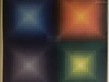 a painting of four squares of different colors in a white frame