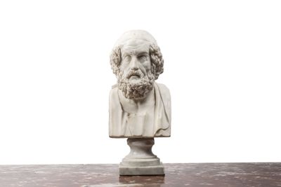 marble bust of a man with a beard on a marble table