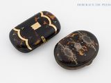 pair of tortoise shell pill cases with gold trim