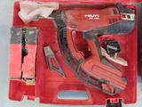 a red tool box with tools in it on a table