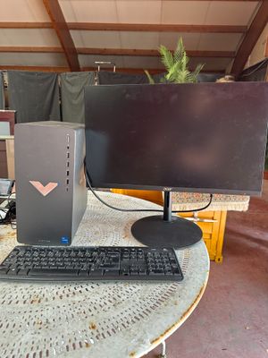 a desktop computer sitting on a table with a keyboard and monitor