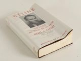 an old book with a picture of a man on it sitting on a table