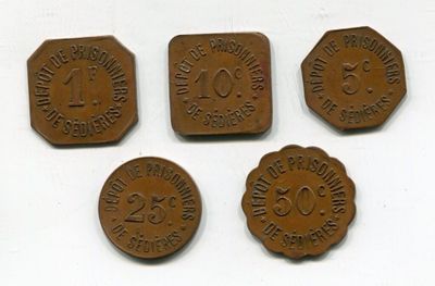 four different types of coins are shown on a white surface