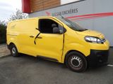the yellow van is parked in front of a building with the door open