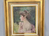 tableau représentant une femme en robe rose assise devant un mur blanc