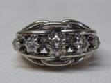 a close up of a ring with diamonds on it