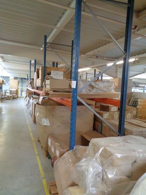 a large warehouse filled with lots of boxes and pallets