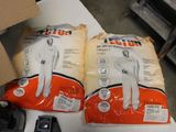 two bags of flour sitting on a table next to a remote control
