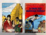 deux livres posés sur une table, avec un dessin représentant un homme sur une échelle et une photo d'un homme sur une échelle