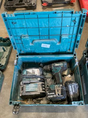 a blue tool box with tools in it on the floor