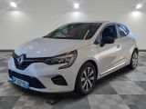 a white car is parked in a room with a checkered floor