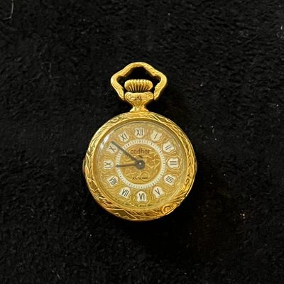 an image of a gold pocket watch with roman numerals on the face