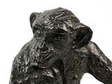 a statue of a monkey that is sitting on a table