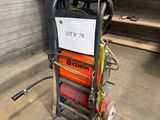 an image of a small hand truck with a hose attached to it