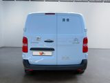 a white van that is parked in a room