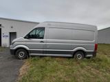 a silver van parked in front of a building