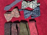 several different ties are laid out on a red surface
